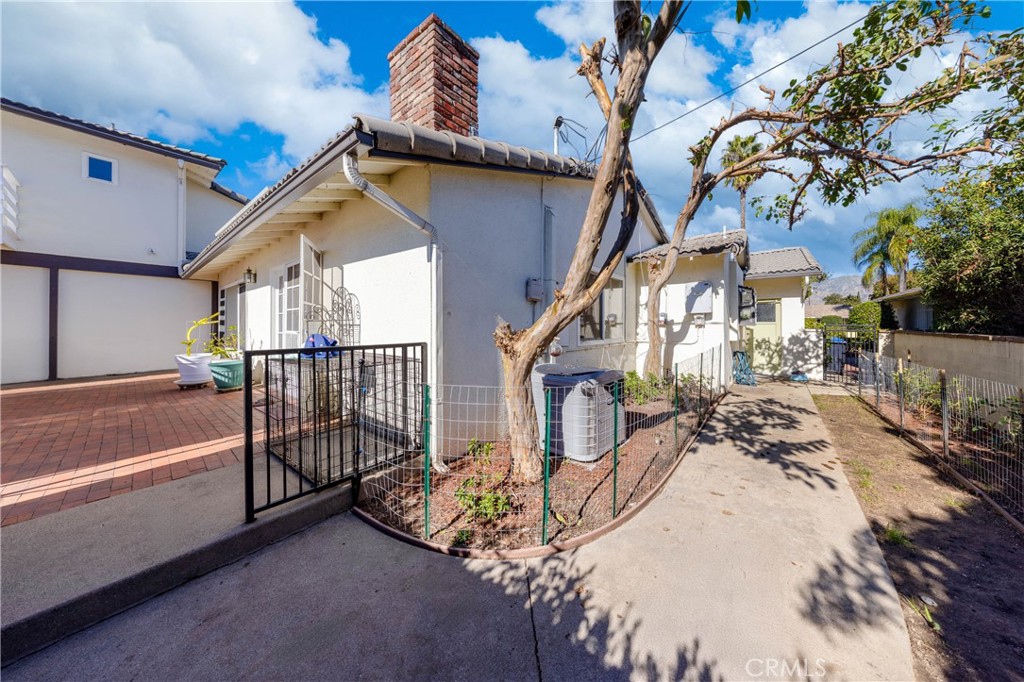 648 Sharon Road Arcadia, CA 91007 - Photo 22 of 26 a view of a house with wooden stairs and a small yard