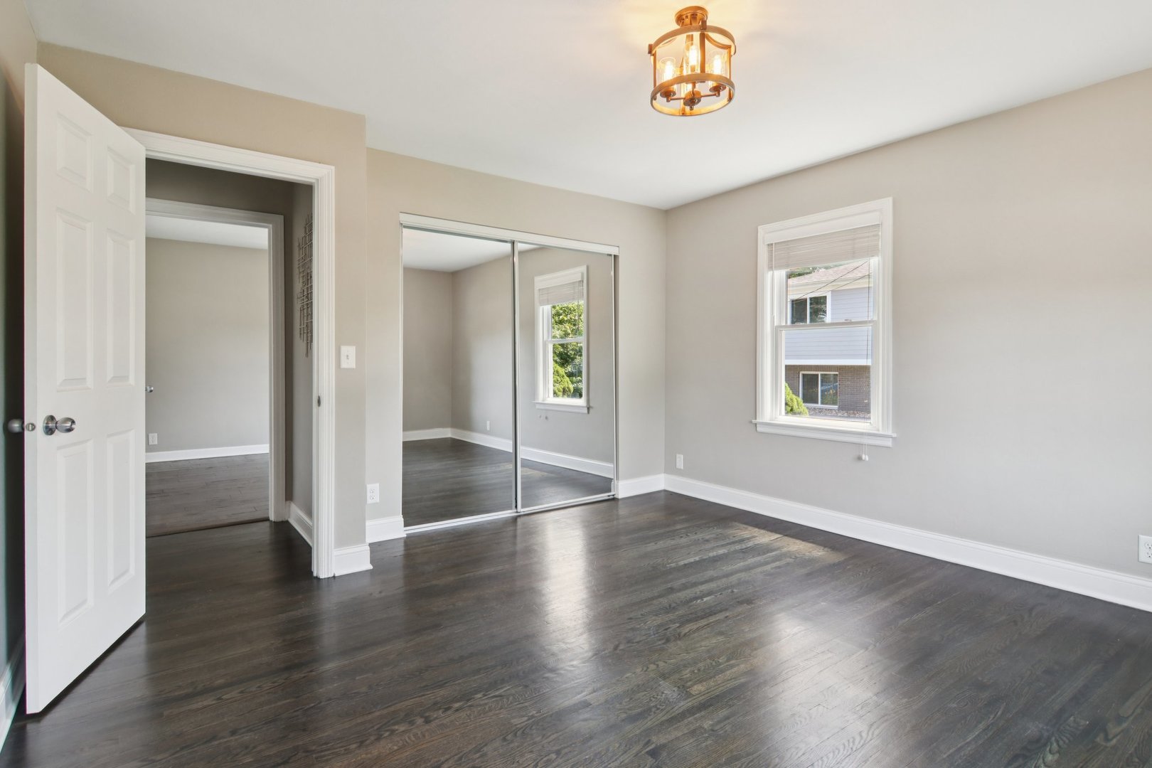 19309 Wolf Road Mokena, IL 60448 - Photo 21 of 37 an empty room with window and wooden floor