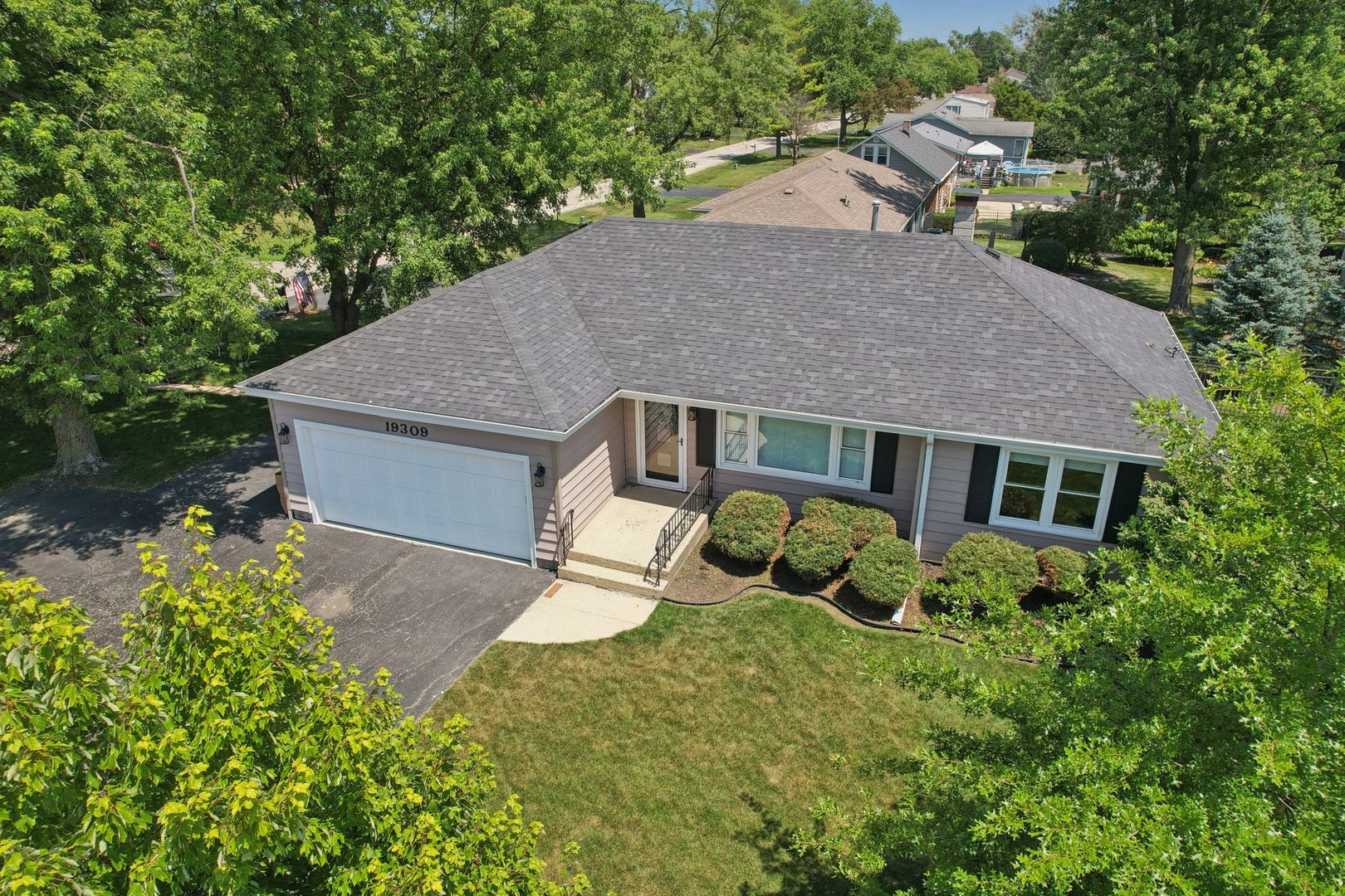 19309 Wolf Road Mokena, IL 60448 - Photo 33 of 37 front view of house with a yard