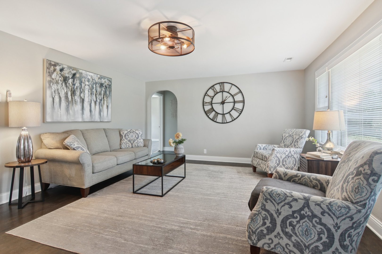 19309 Wolf Road Mokena, IL 60448 - Photo 6 of 37 a living room with furniture a rug and a wall painting
