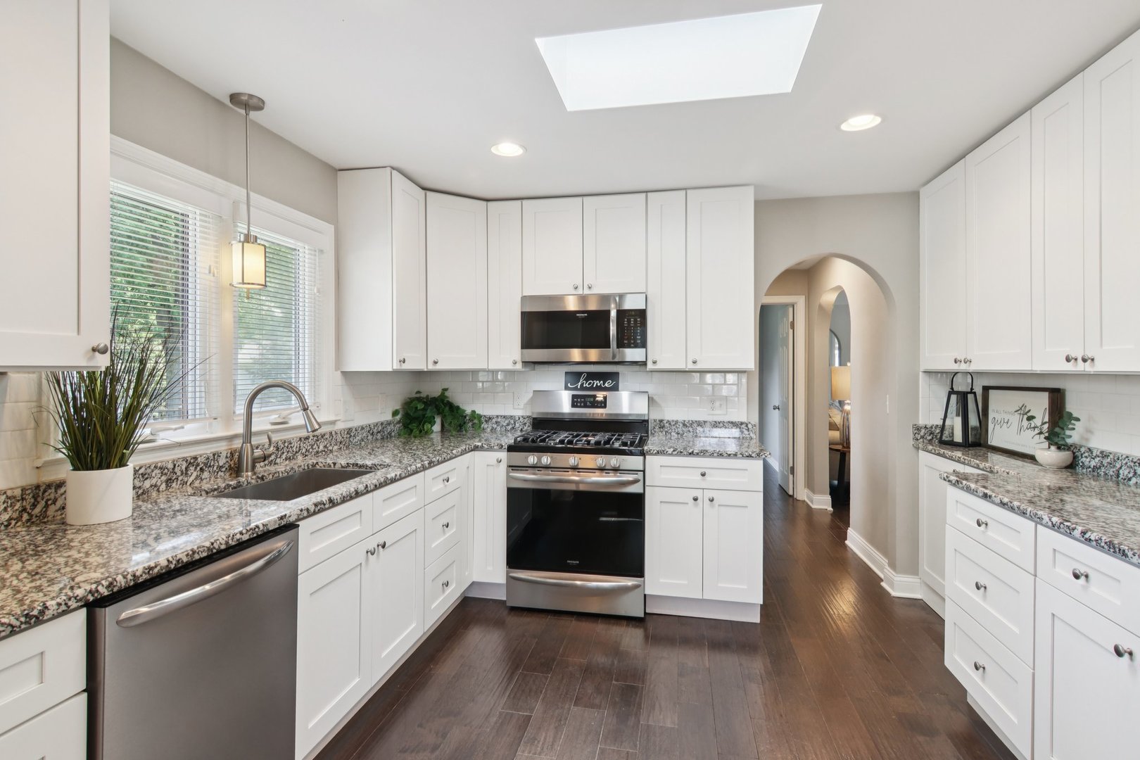 19309 Wolf Road Mokena, IL 60448 - Photo 8 of 37 a kitchen with granite countertop white cabinets and stainless steel appliances