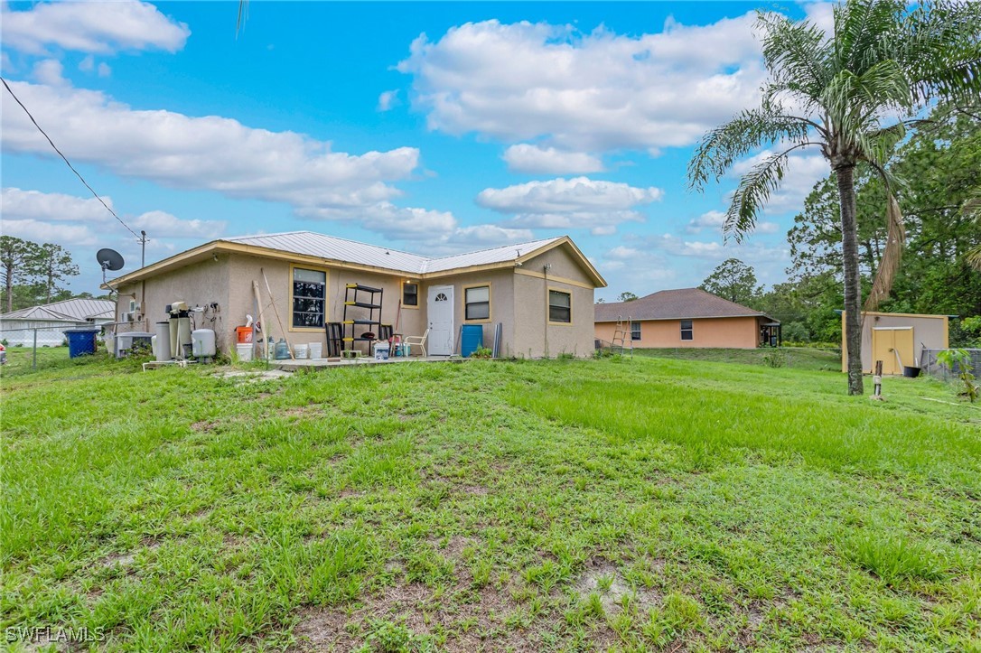 503 East 13th Street Lehigh Acres, FL 33972 - Photo 15 of 15 a view of house that has garden