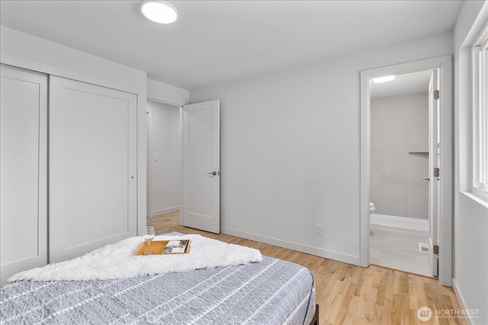10646 Southeast 236th Street Kent, WA 98031 - Photo 11 of 20 a bedroom with a bed and a table