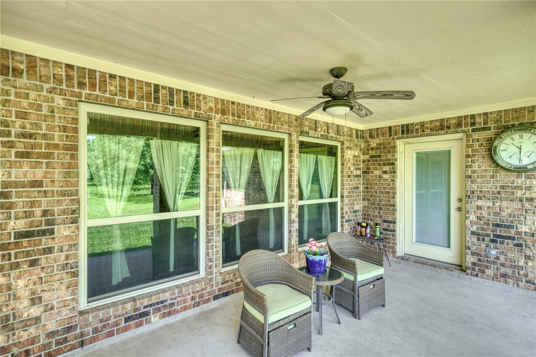 9945 Oxford Cemetery Road Madisonville, TX 77864 - Photo 26 of 42 View of patio / terrace featuring a ceiling fan