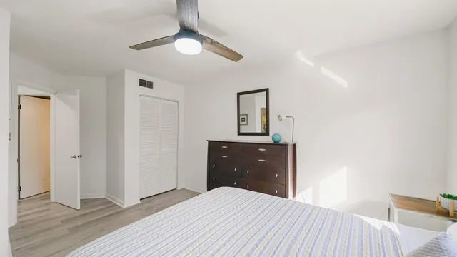 a bedroom with a bed and a dresser