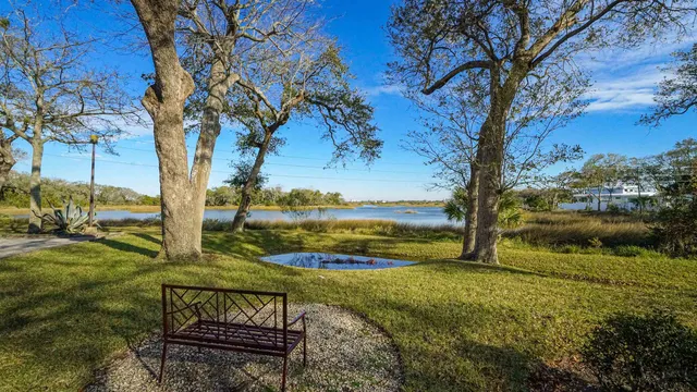 a view of a lake with a yard