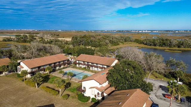 an aerial view of a house with a lake view