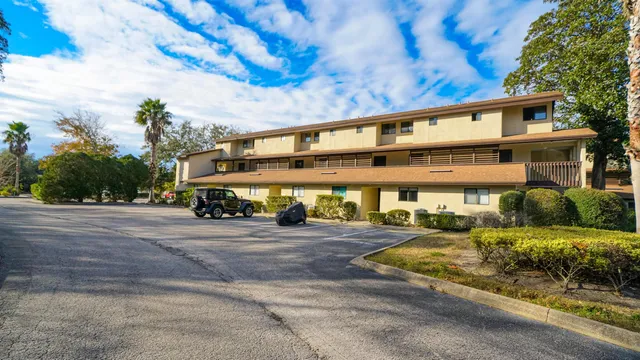 a large building with swimming pool in front of it