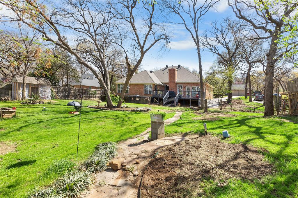 1007 Santa Fe Street Denton, TX 76205 - Photo 29 of 37 Fenced yard featuring a wooden deck