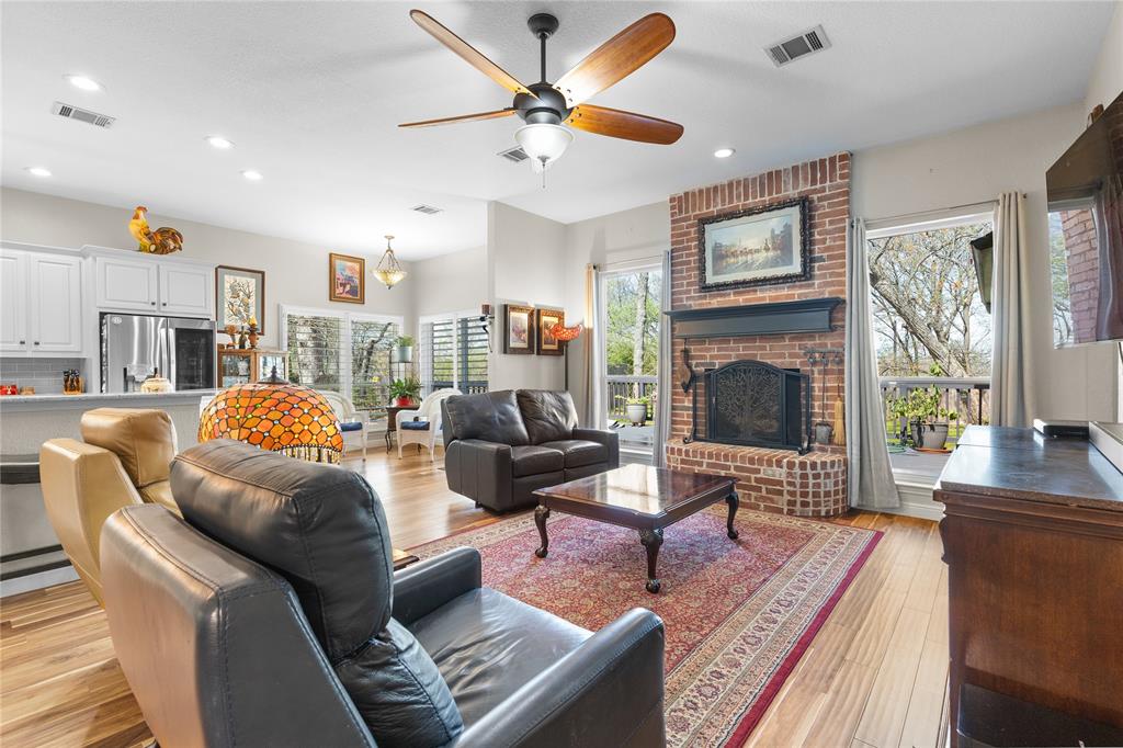 1007 Santa Fe Street Denton, TX 76205 - Photo 8 of 37 Living room featuring ceiling fan, light wood-type flooring, recessed lighting, and a fireplace