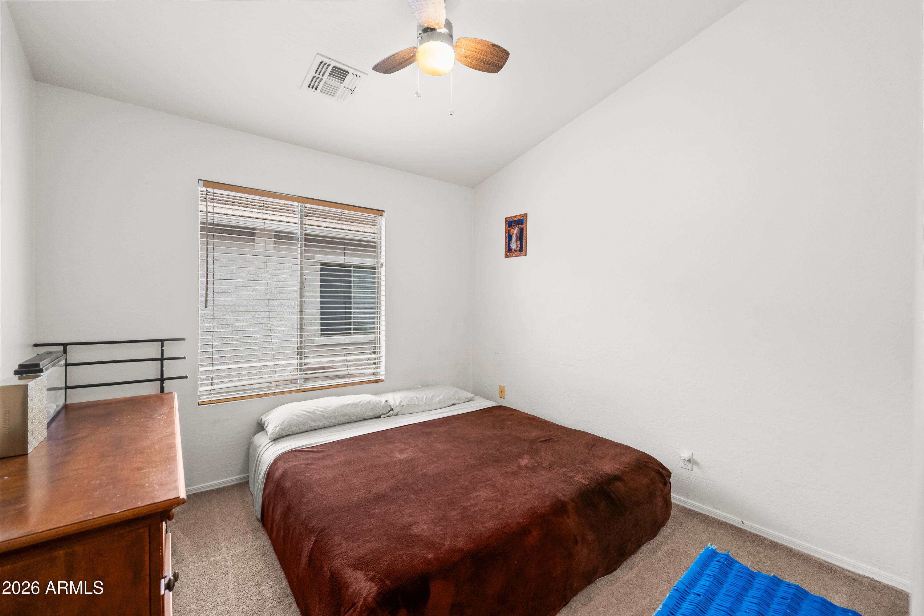 2150 East Bell Road, Unit 1159 Phoenix, AZ 85022 - Photo 20 of 26 a bedroom with a bed and a window