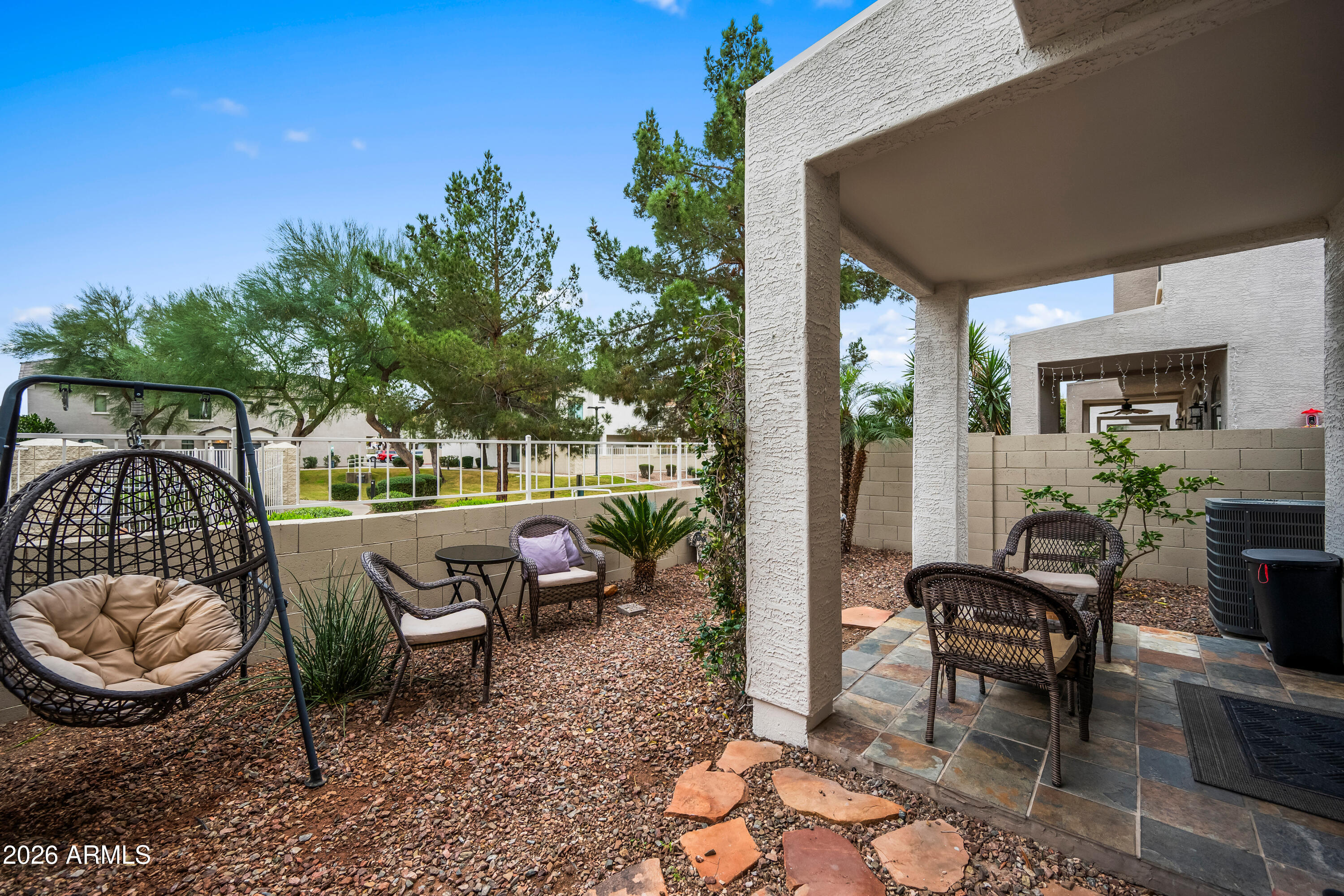 2150 East Bell Road, Unit 1159 Phoenix, AZ 85022 - Photo 22 of 26 a view of a patio with couches table and chairs and potted plants