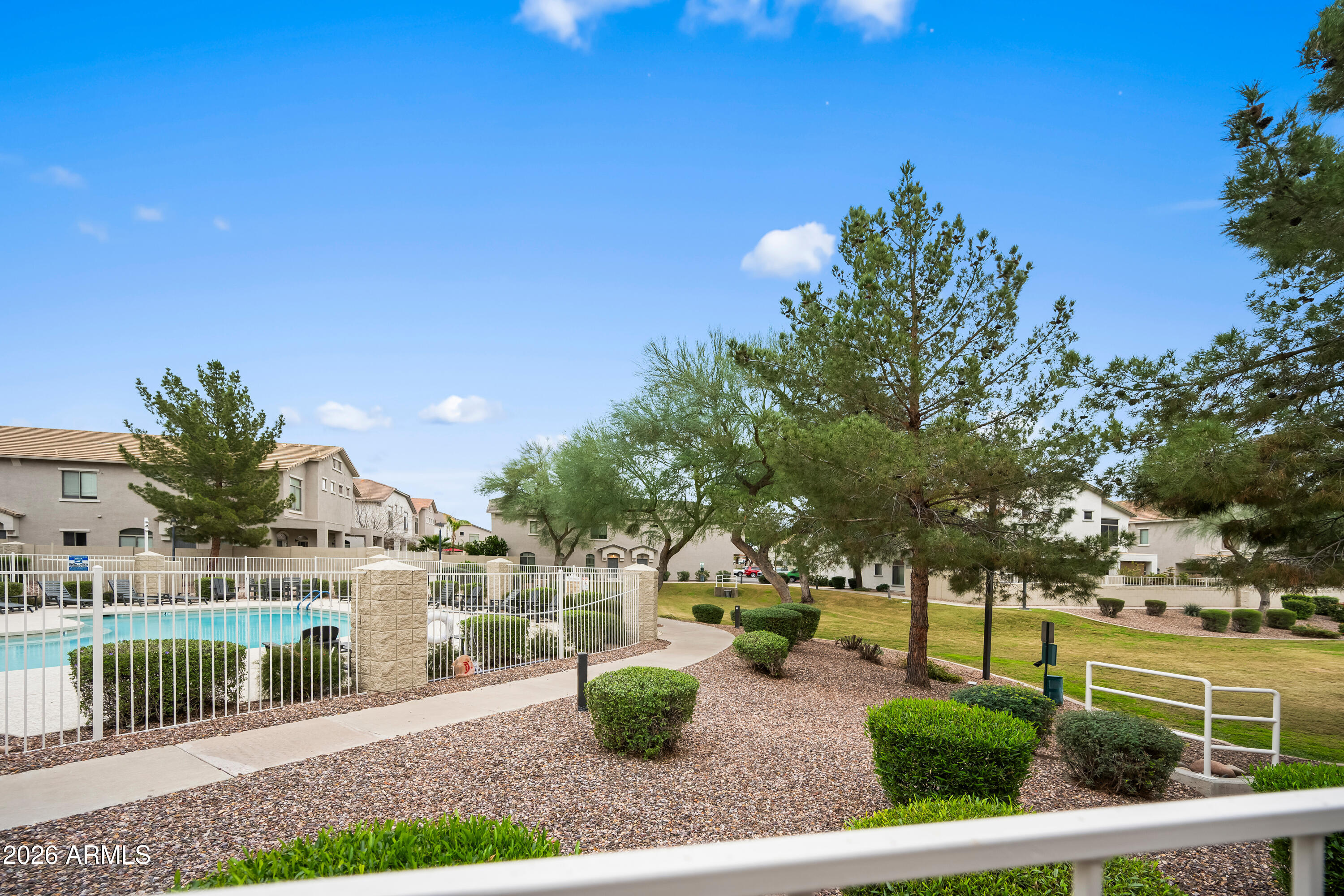 2150 East Bell Road, Unit 1159 Phoenix, AZ 85022 - Photo 23 of 26 a view of a house with backyard and sitting area