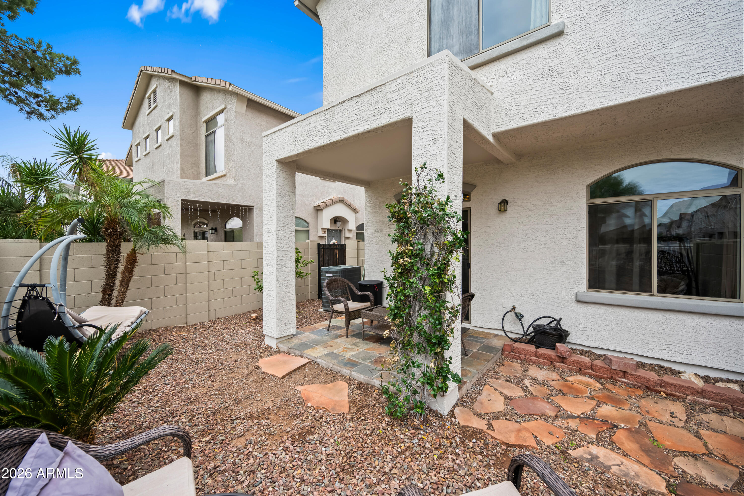 2150 East Bell Road, Unit 1159 Phoenix, AZ 85022 - Photo 25 of 26 a front view of a house with a yard