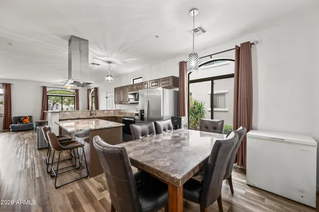 a view of a dining room with furniture window and outside view