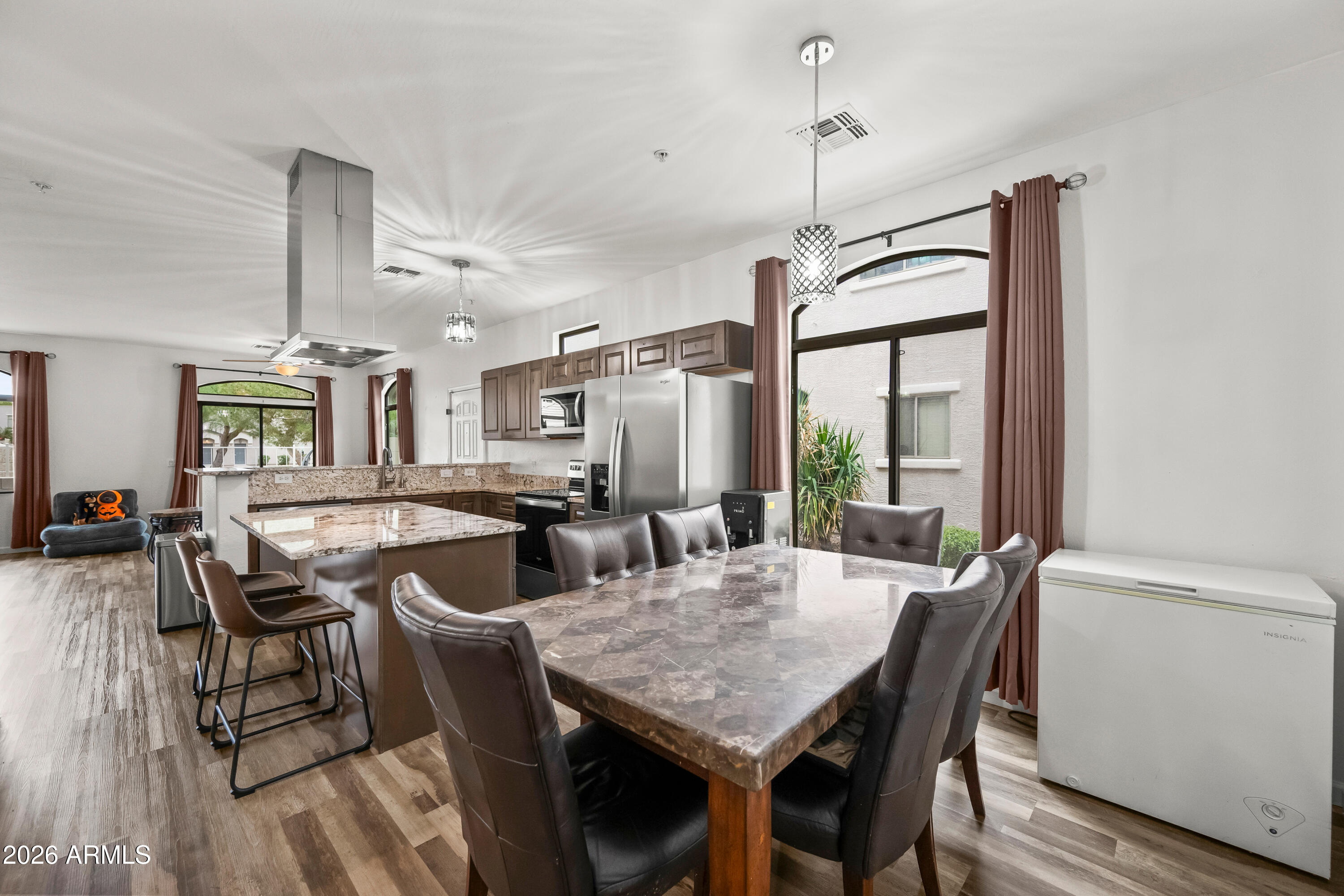 2150 East Bell Road, Unit 1159 Phoenix, AZ 85022 - Photo 7 of 26 a view of a dining room with furniture window and outside view