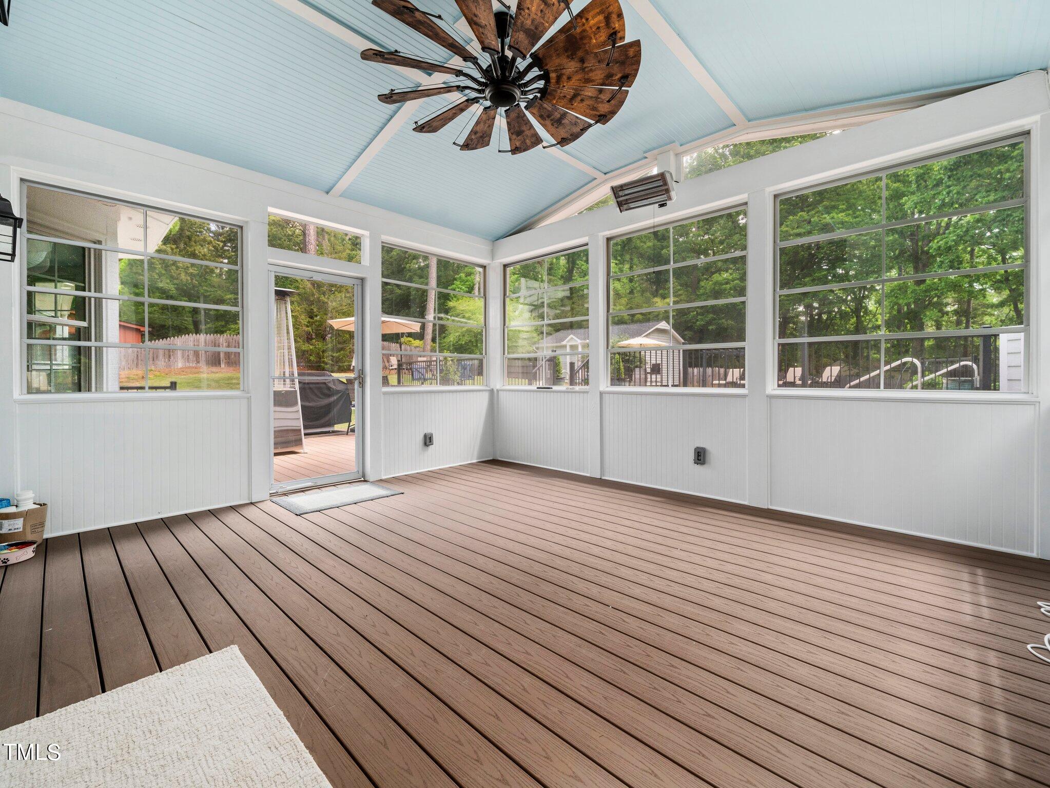 7800 Whitley Drive Raleigh, NC 27613 - Photo 13 of 17 a view of an empty room with a window and wooden floor