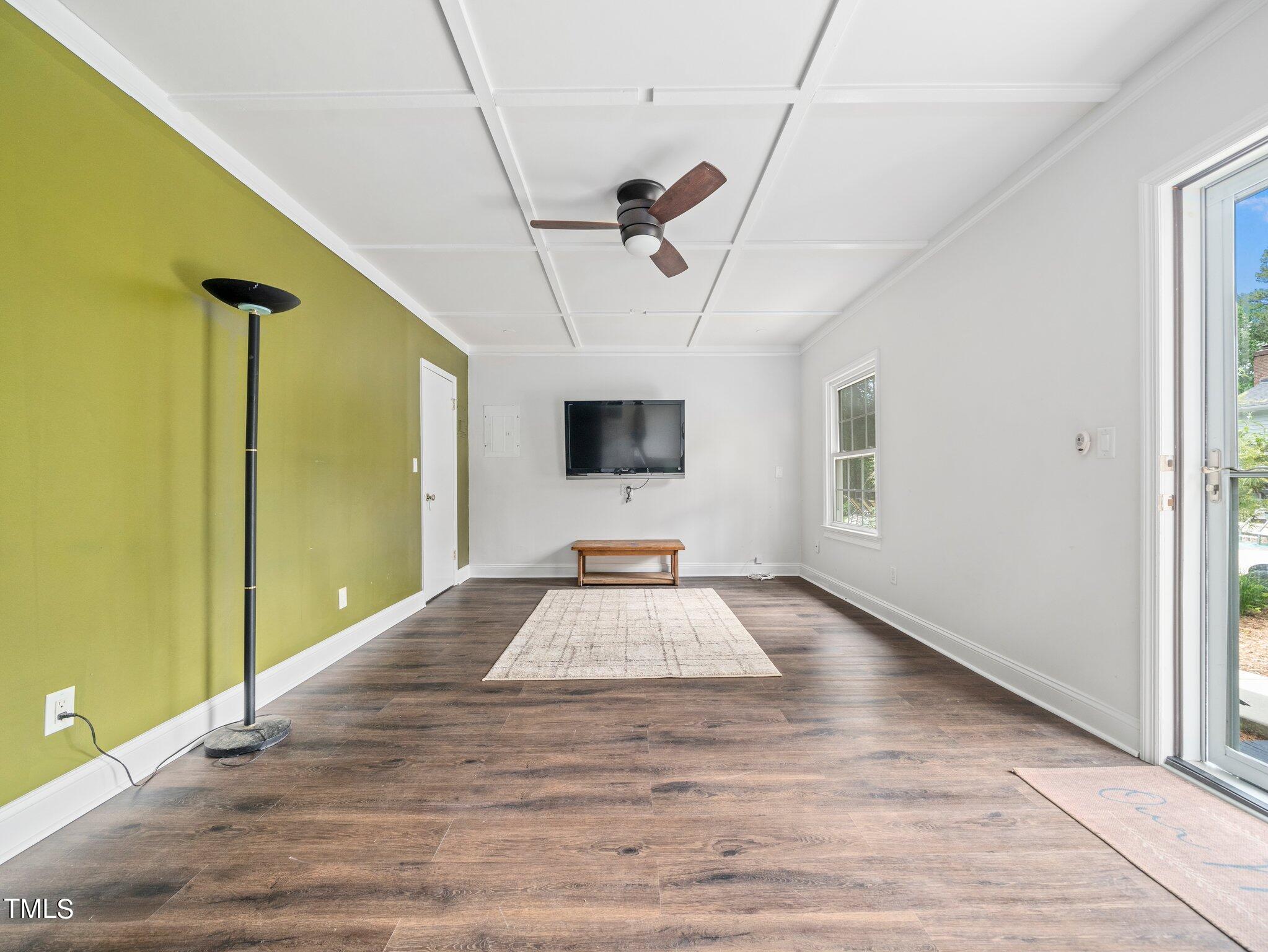 7800 Whitley Drive Raleigh, NC 27613 - Photo 15 of 17 a view of a room with wooden floor and windows