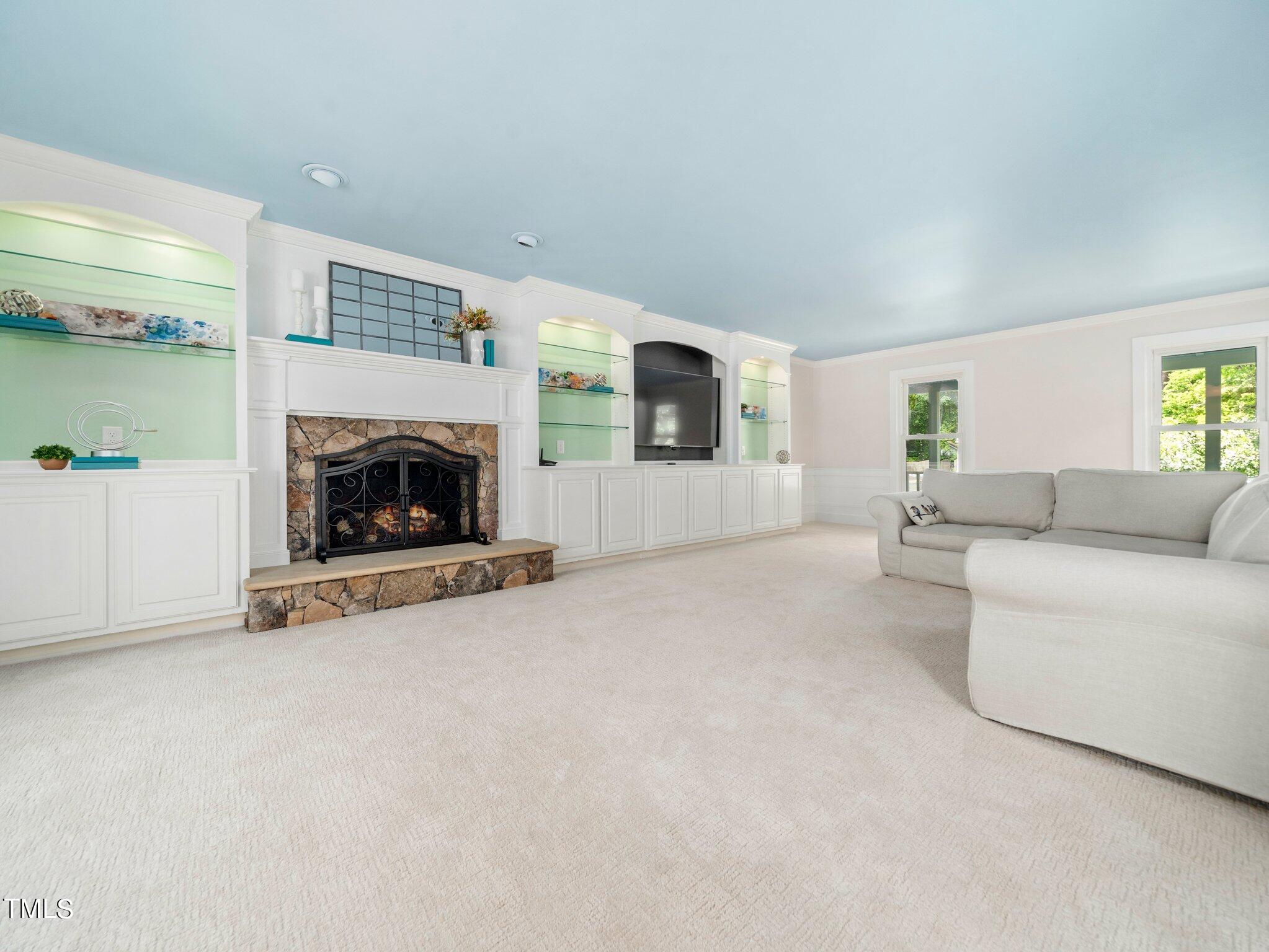 7800 Whitley Drive Raleigh, NC 27613 - Photo 7 of 17 a living room with furniture and a fireplace
