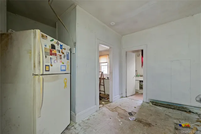 a refrigerator freezer sitting inside of a kitchen