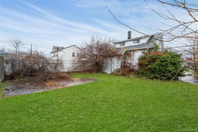 a view of a big yard next to a house