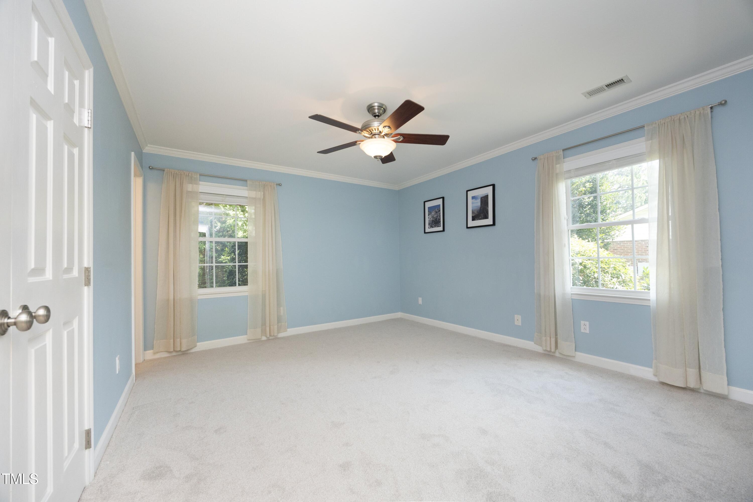 3112 Carovel Court Raleigh, NC 27607 - Photo 21 of 44 Primary bedroom; spacious with view onto private back yard.