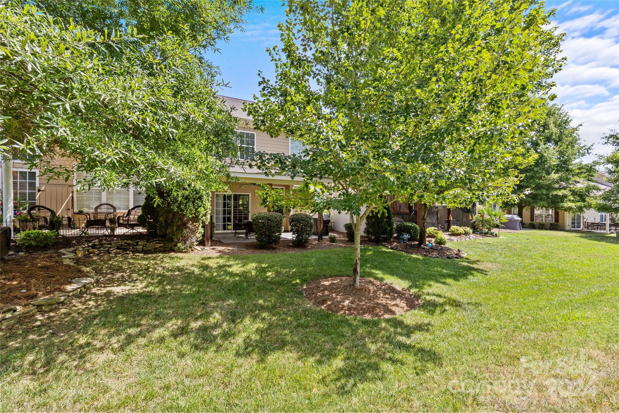 1034 Silver Gull Drive Tega Cay, SC 29708 - Photo 29 of 32 a view of a yard with plants and trees