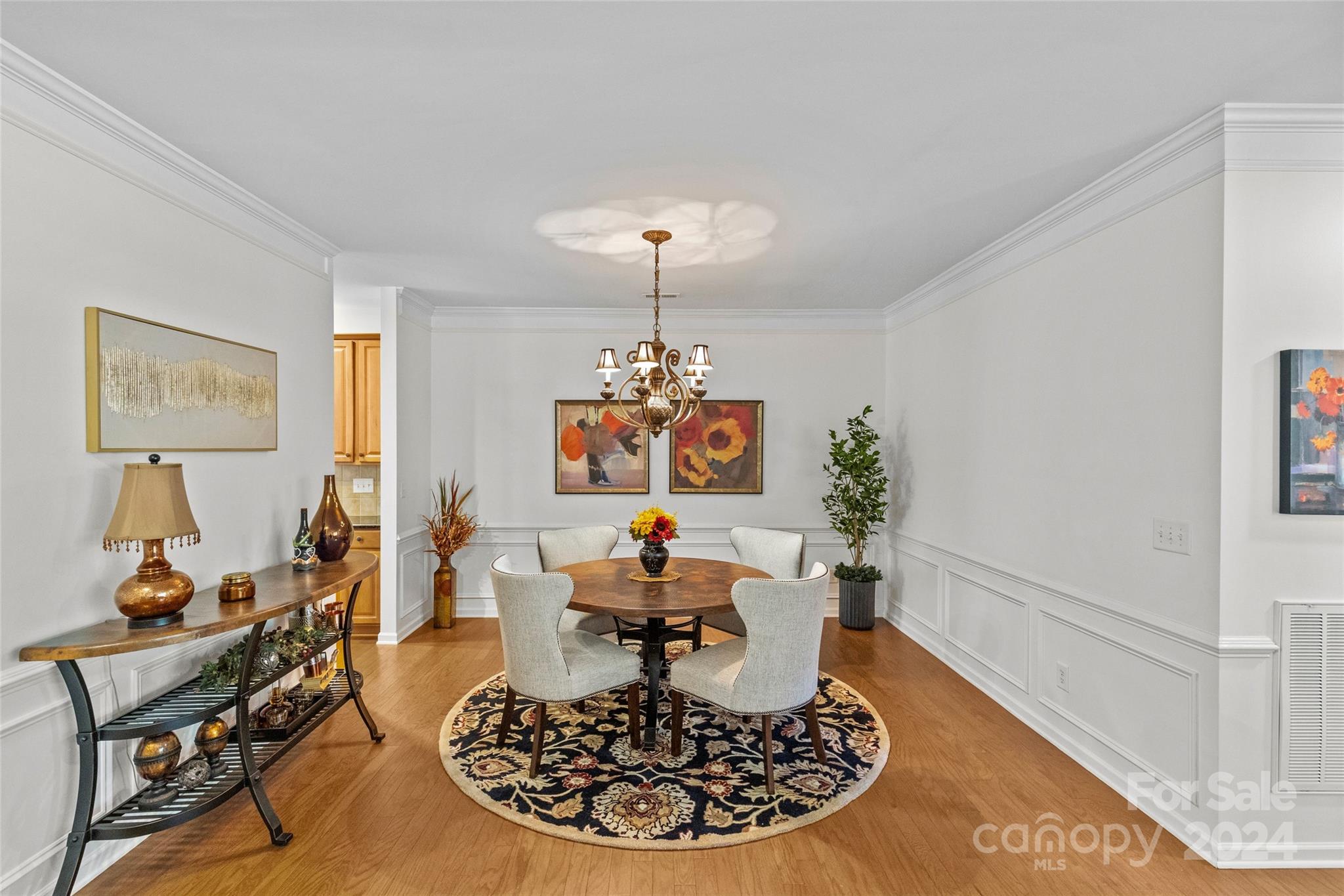 1034 Silver Gull Drive Tega Cay, SC 29708 - Photo 5 of 32 a living room with furniture and a chandelier