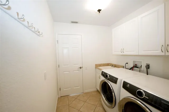 a view of a porch with a floor to ceiling windows and a yard