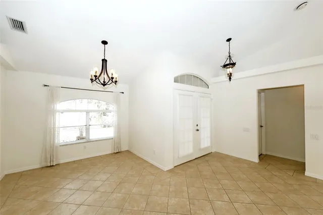 a view of empty room with windows