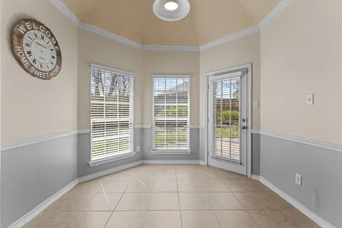 a large kitchen with a large window