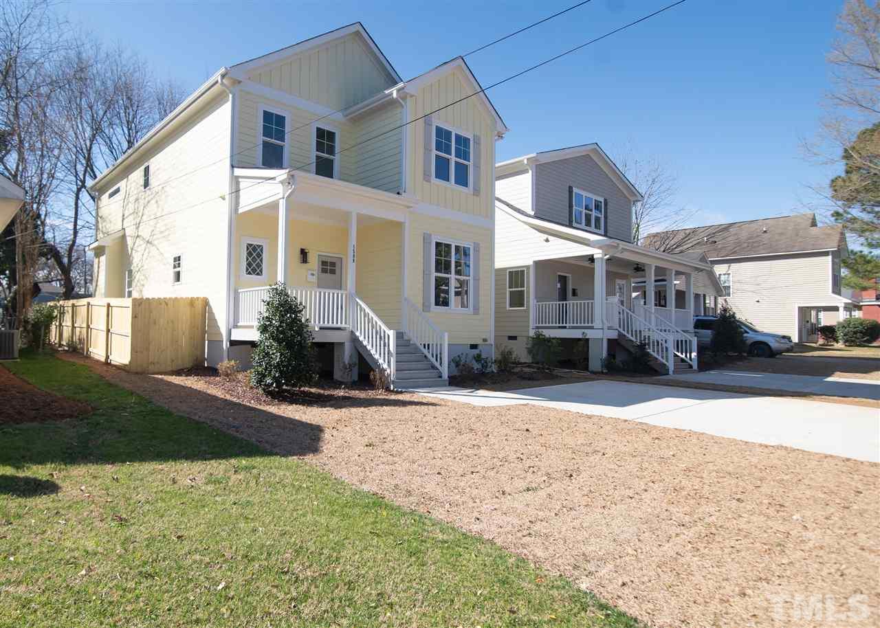 1508 East Lane Street Raleigh, NC 27610 - Photo 2 of 30 a front view of a house with a yard and garage