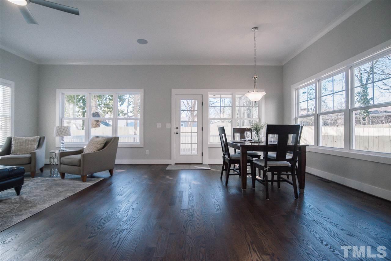 1508 East Lane Street Raleigh, NC 27610 - Photo 14 of 30 a view of a dining room with furniture window and wooden floor