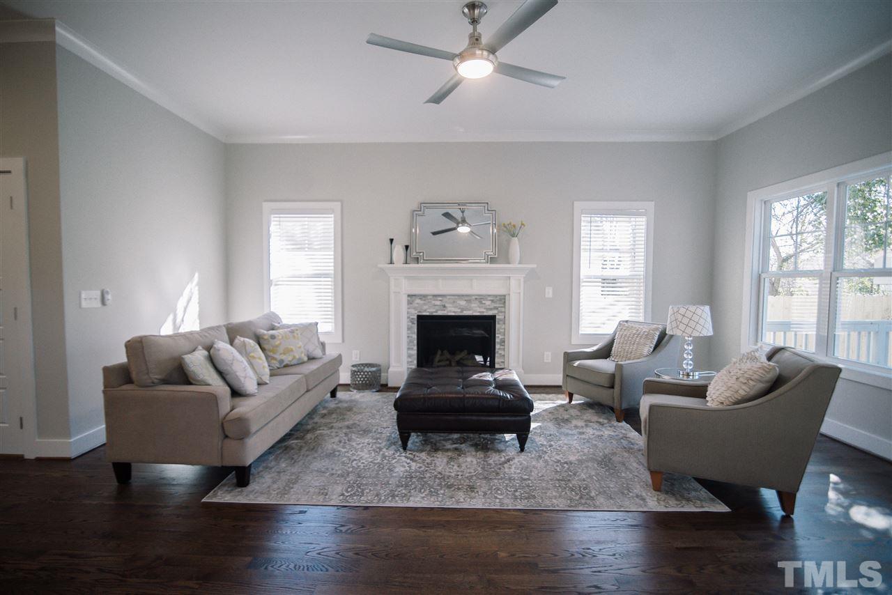 1508 East Lane Street Raleigh, NC 27610 - Photo 16 of 30 a living room with furniture and a fireplace