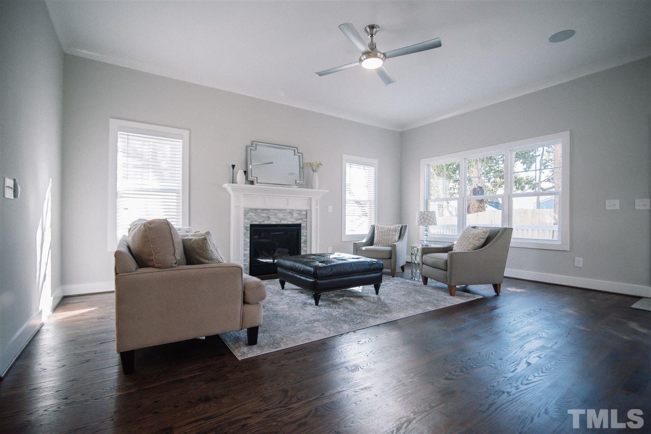 1508 East Lane Street Raleigh, NC 27610 - Photo 17 of 30 a living room with furniture and a fireplace