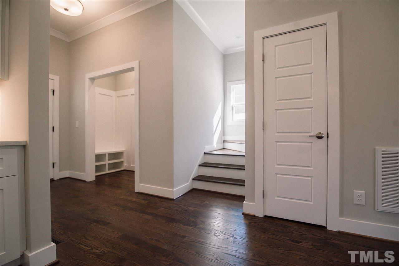 1508 East Lane Street Raleigh, NC 27610 - Photo 20 of 30 an empty room with wooden floor & entryway