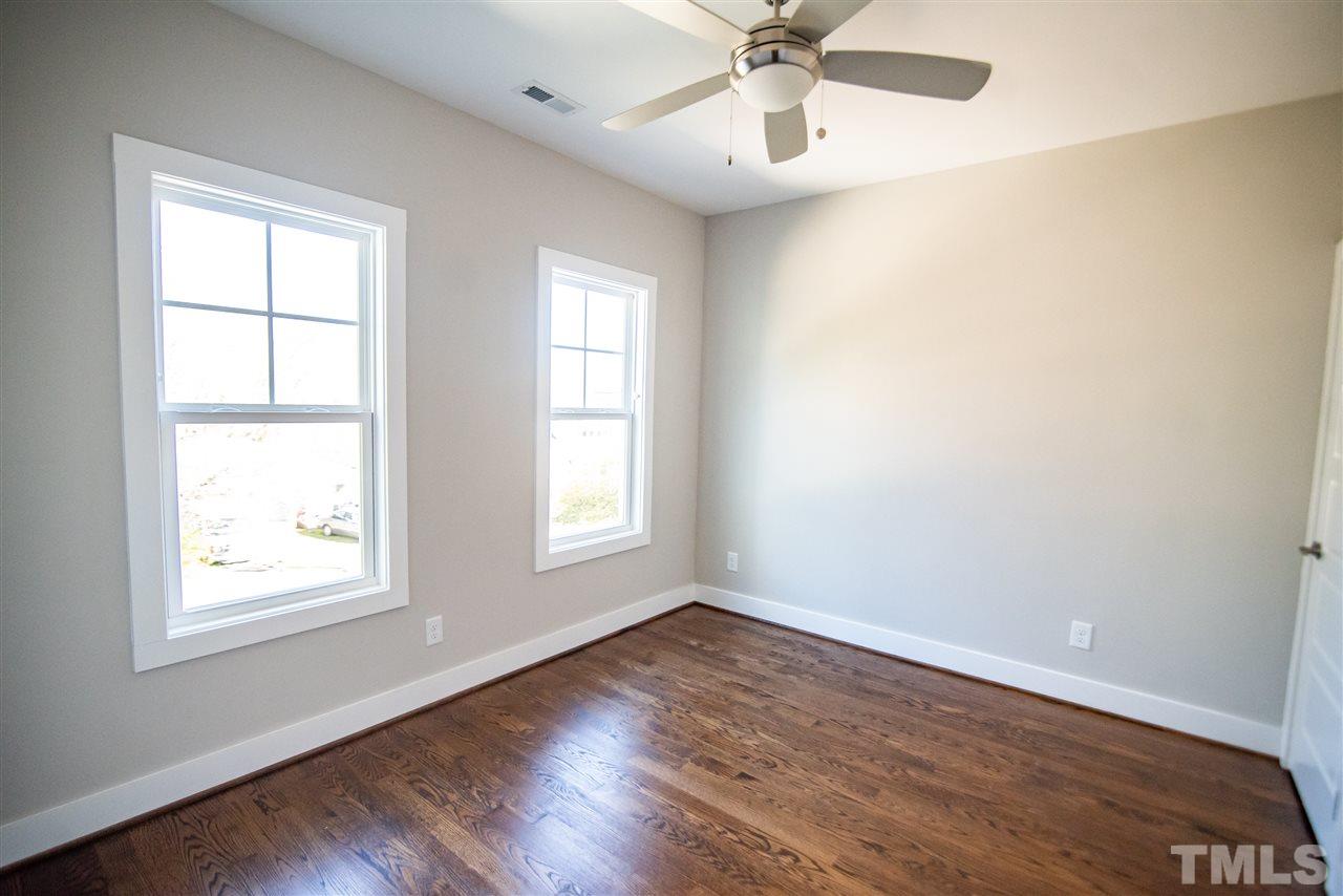 1508 East Lane Street Raleigh, NC 27610 - Photo 25 of 30 wooden floor in an empty room with a window
