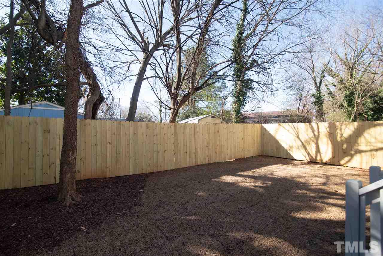 1508 East Lane Street Raleigh, NC 27610 - Photo 30 of 30 a view of a backyard with large trees