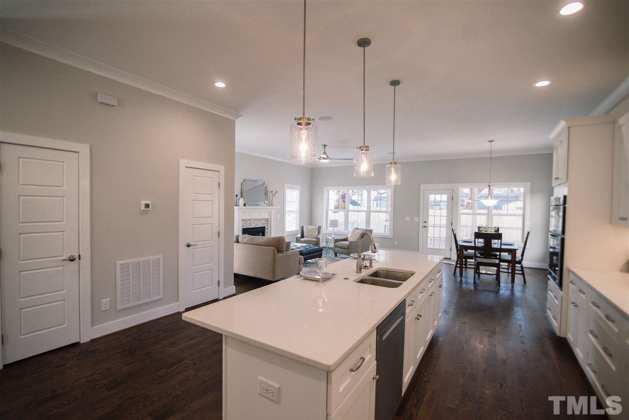 1508 East Lane Street Raleigh, NC 27610 - Photo 8 of 30 a view of a kitchen and dining room
