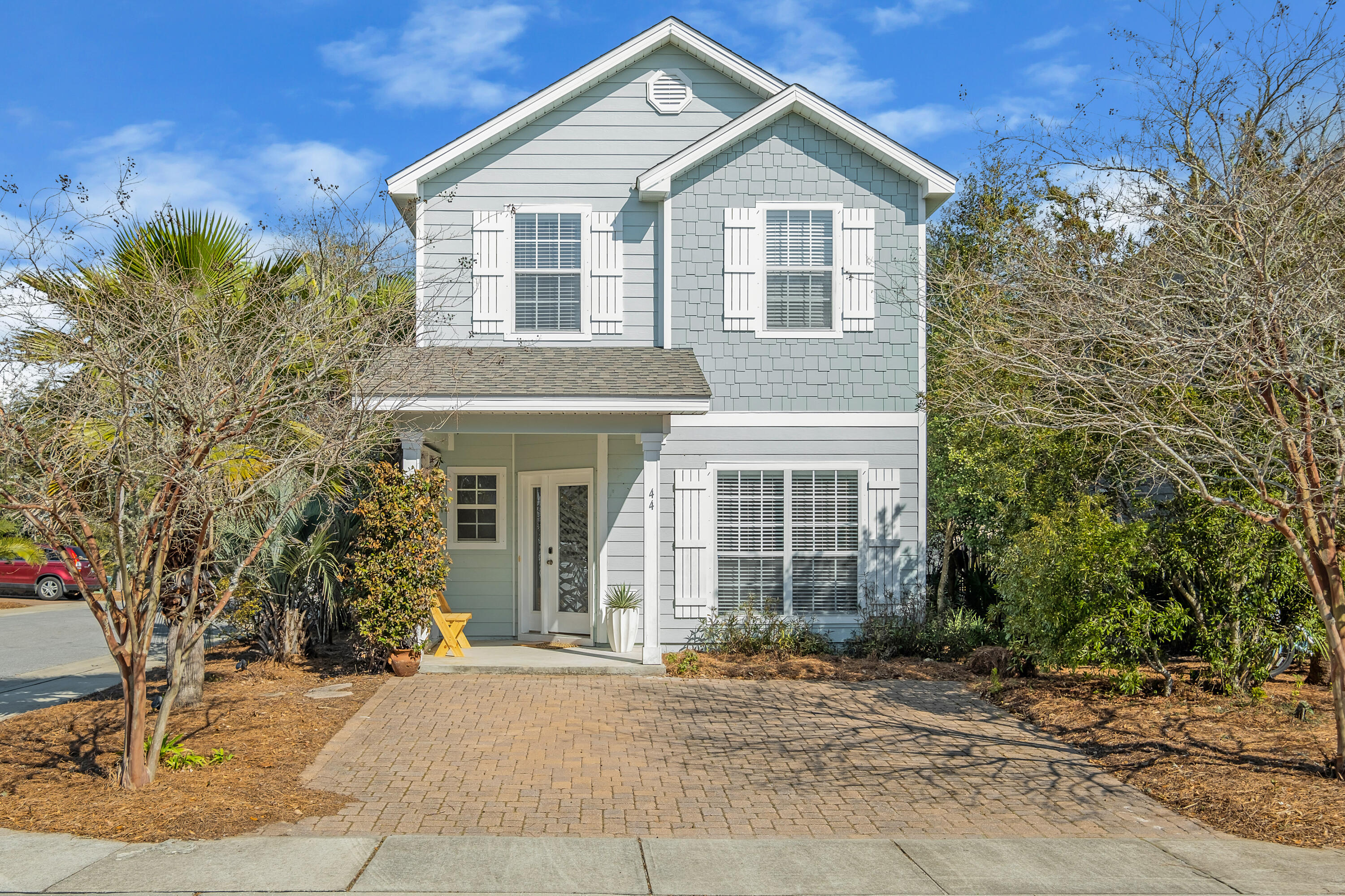44 St Vincent Lane Inlet Beach, FL 32461 - Photo 1 of 45 a front view of a house with a yard and garage