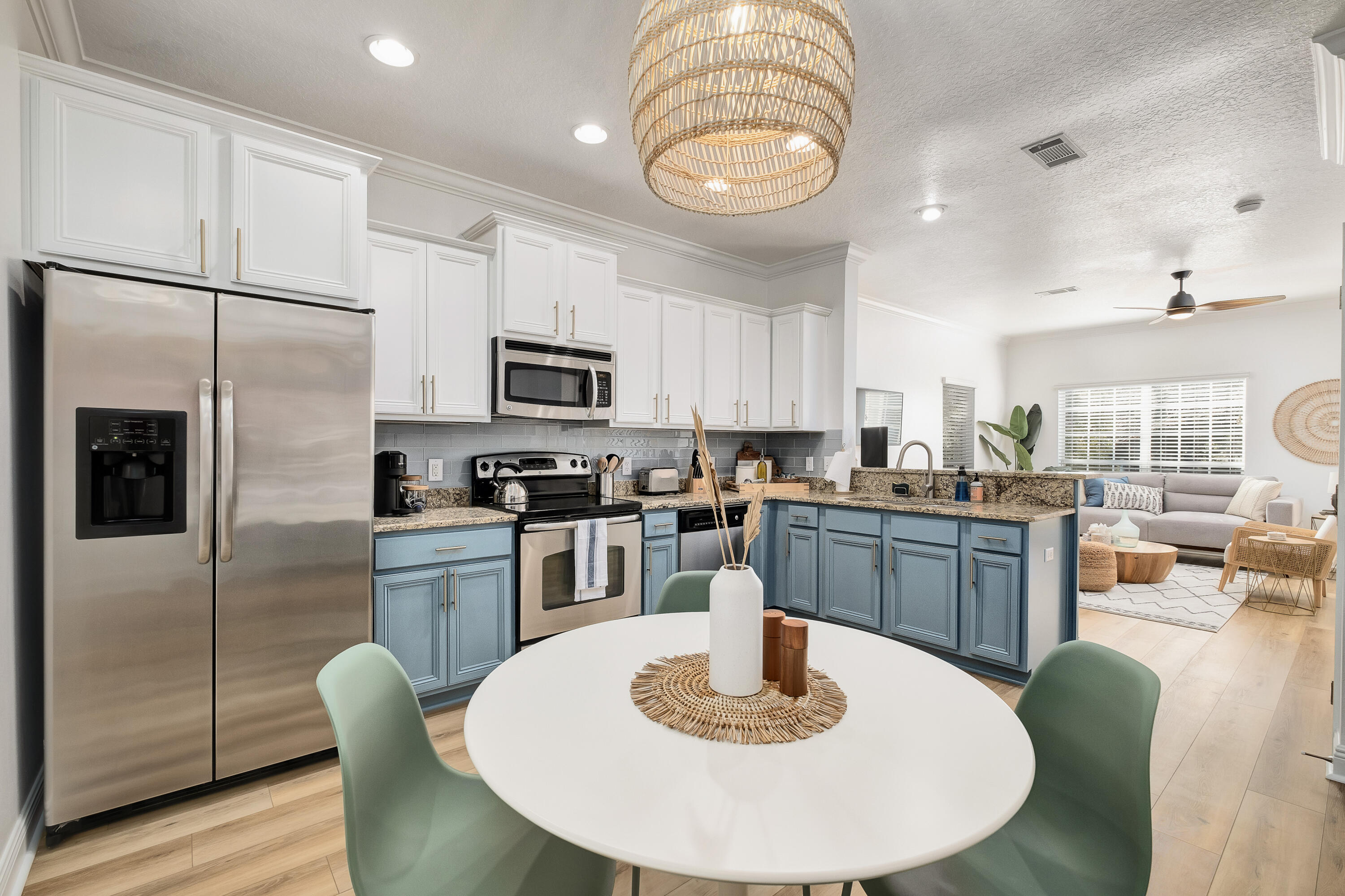 44 St Vincent Lane Inlet Beach, FL 32461 - Photo 14 of 45 a kitchen with a refrigerator a stove a sink a dining table and chairs