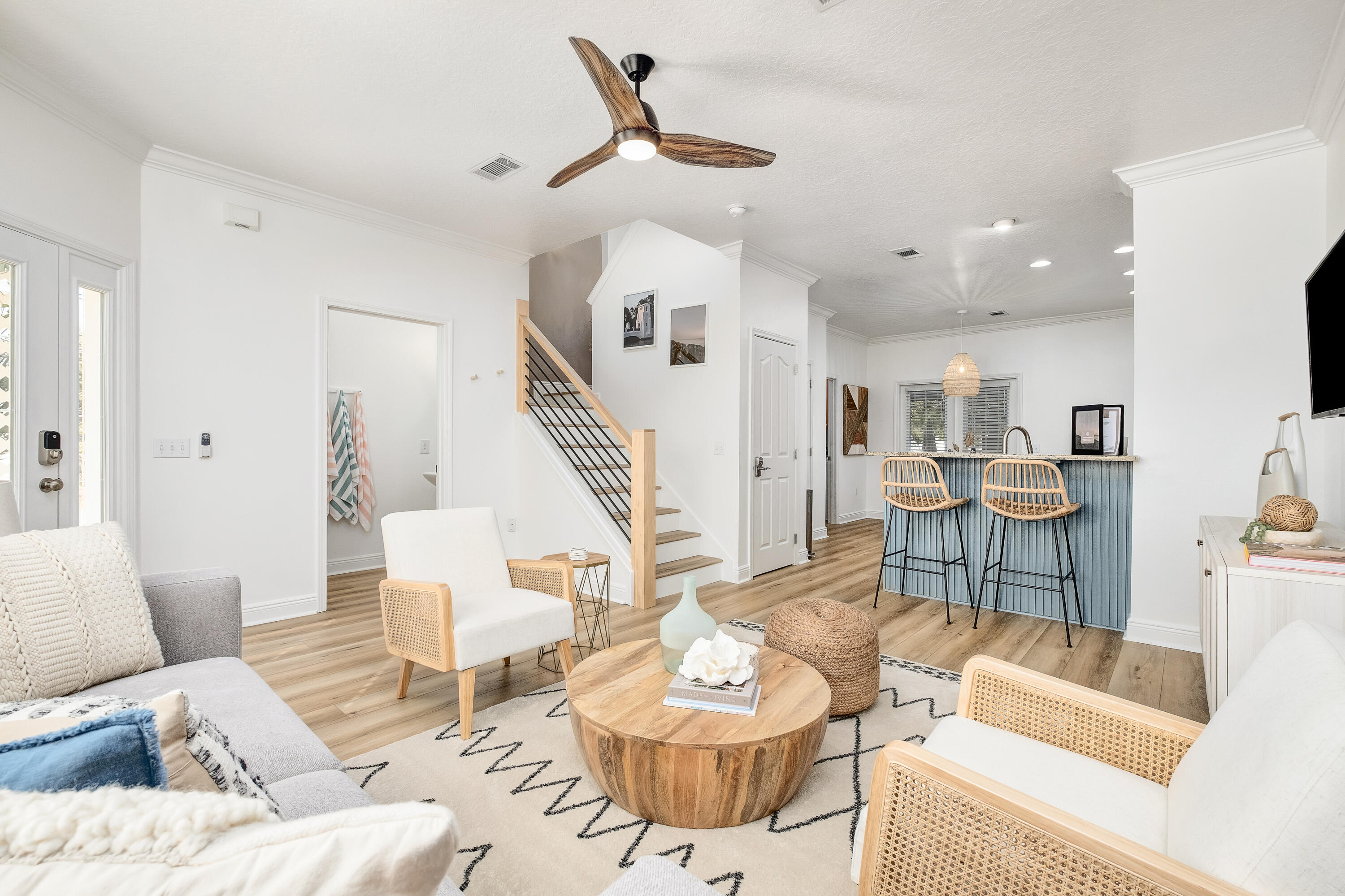 44 St Vincent Lane Inlet Beach, FL 32461 - Photo 2 of 45 a living room with furniture kitchen view and a wooden floor