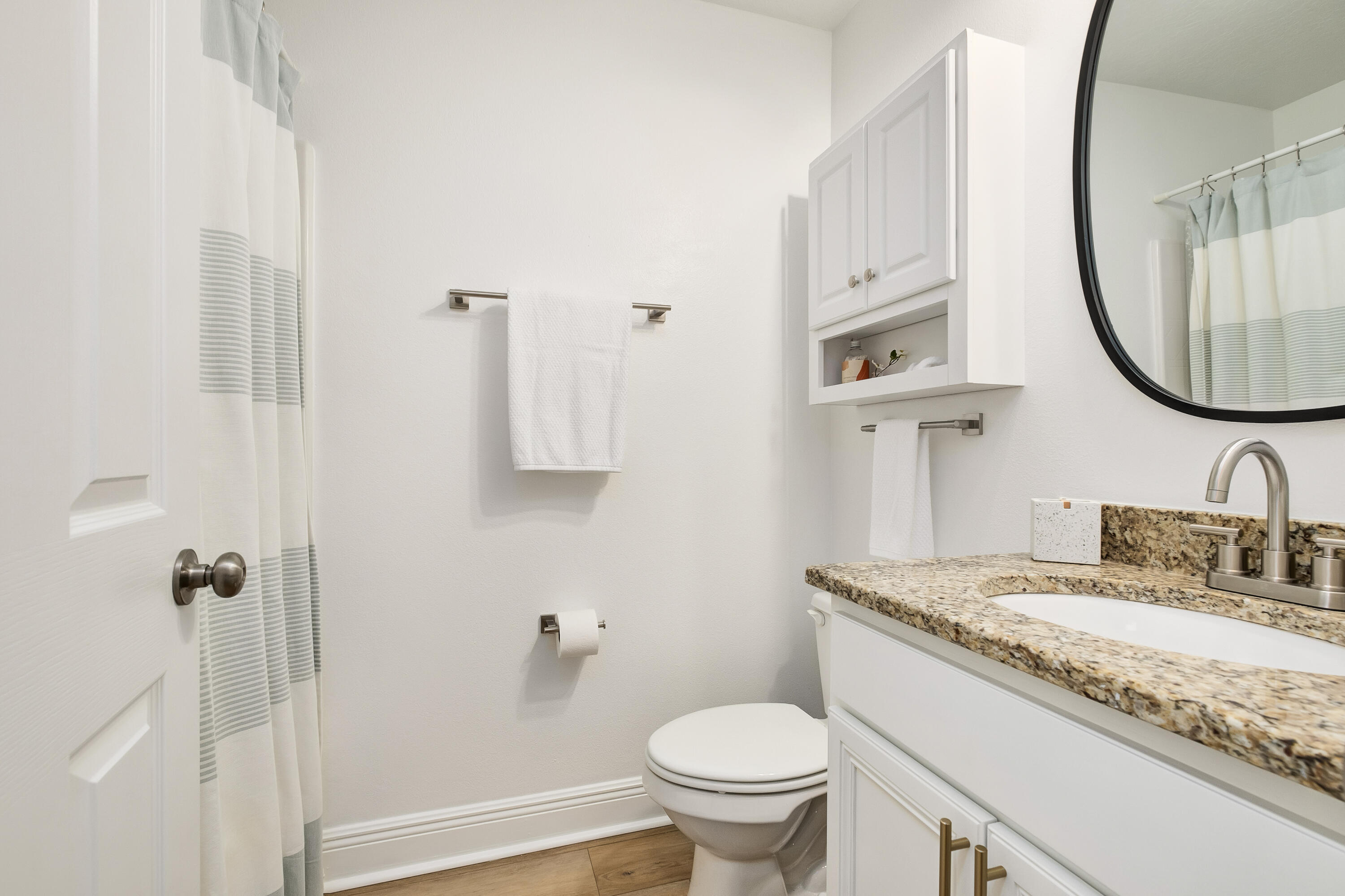 44 St Vincent Lane Inlet Beach, FL 32461 - Photo 24 of 45 a bathroom with a granite countertop sink a toilet and a mirror