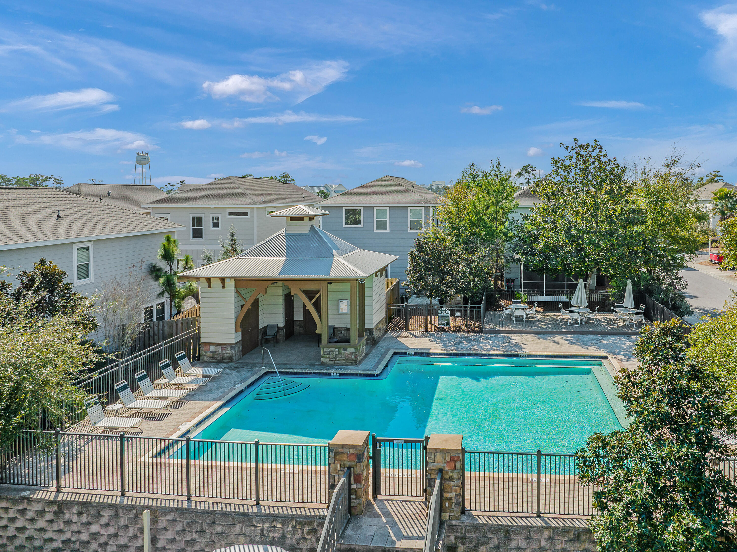 44 St Vincent Lane Inlet Beach, FL 32461 - Photo 4 of 45 a view of a patio with couches table and chairs and potted plants