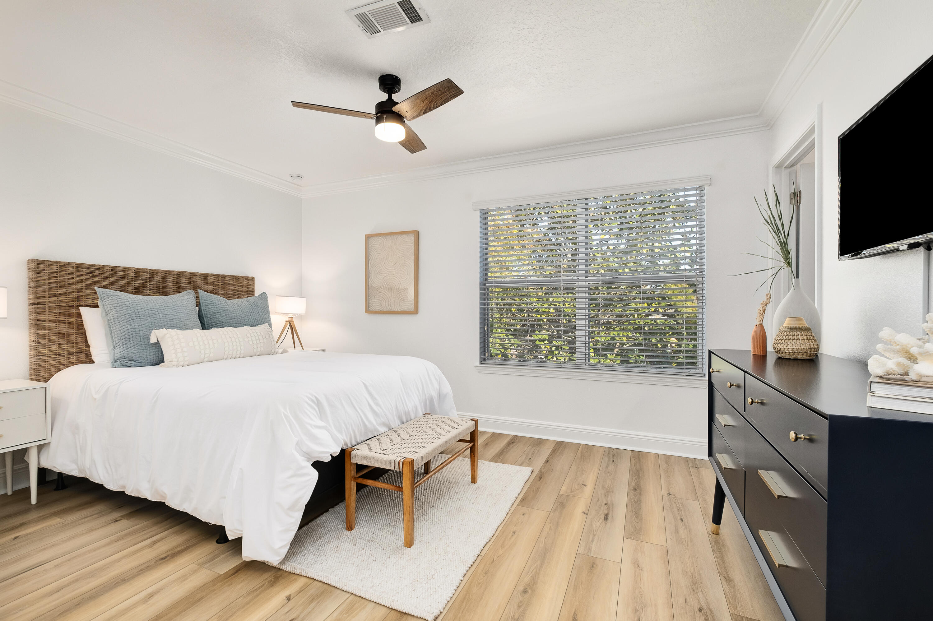 44 St Vincent Lane Inlet Beach, FL 32461 - Photo 5 of 45 a bedroom with a bed a flat screen tv and a large window