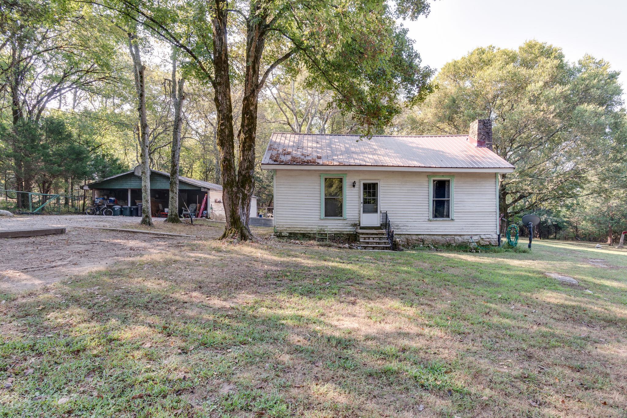 1452 Iron Bridge Road Columbia, TN 38401 - Photo 2 of 19 a view of a house with backyard and trees