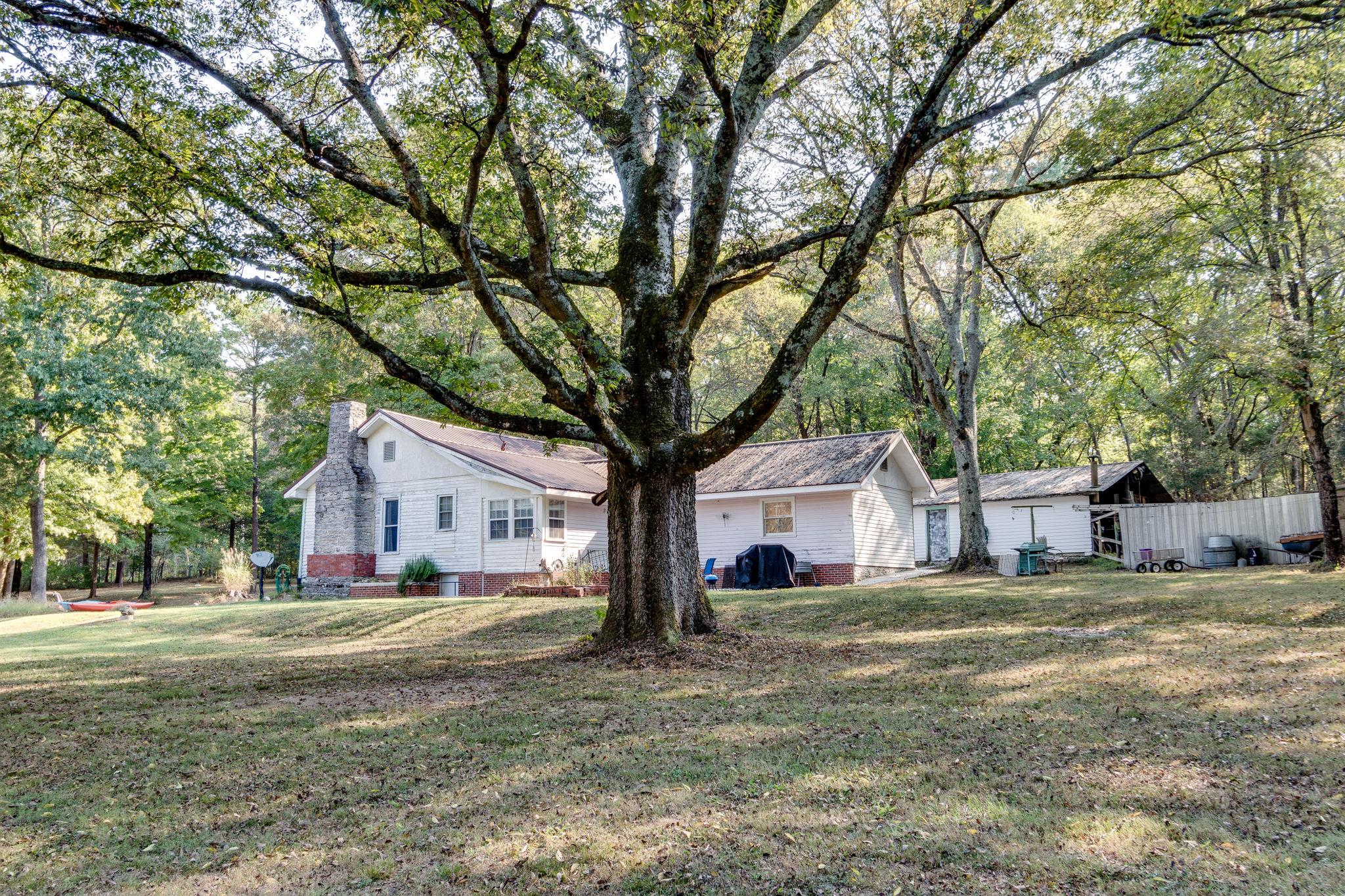 1452 Iron Bridge Road Columbia, TN 38401 - Photo 5 of 19 a house that has a tree in front of it