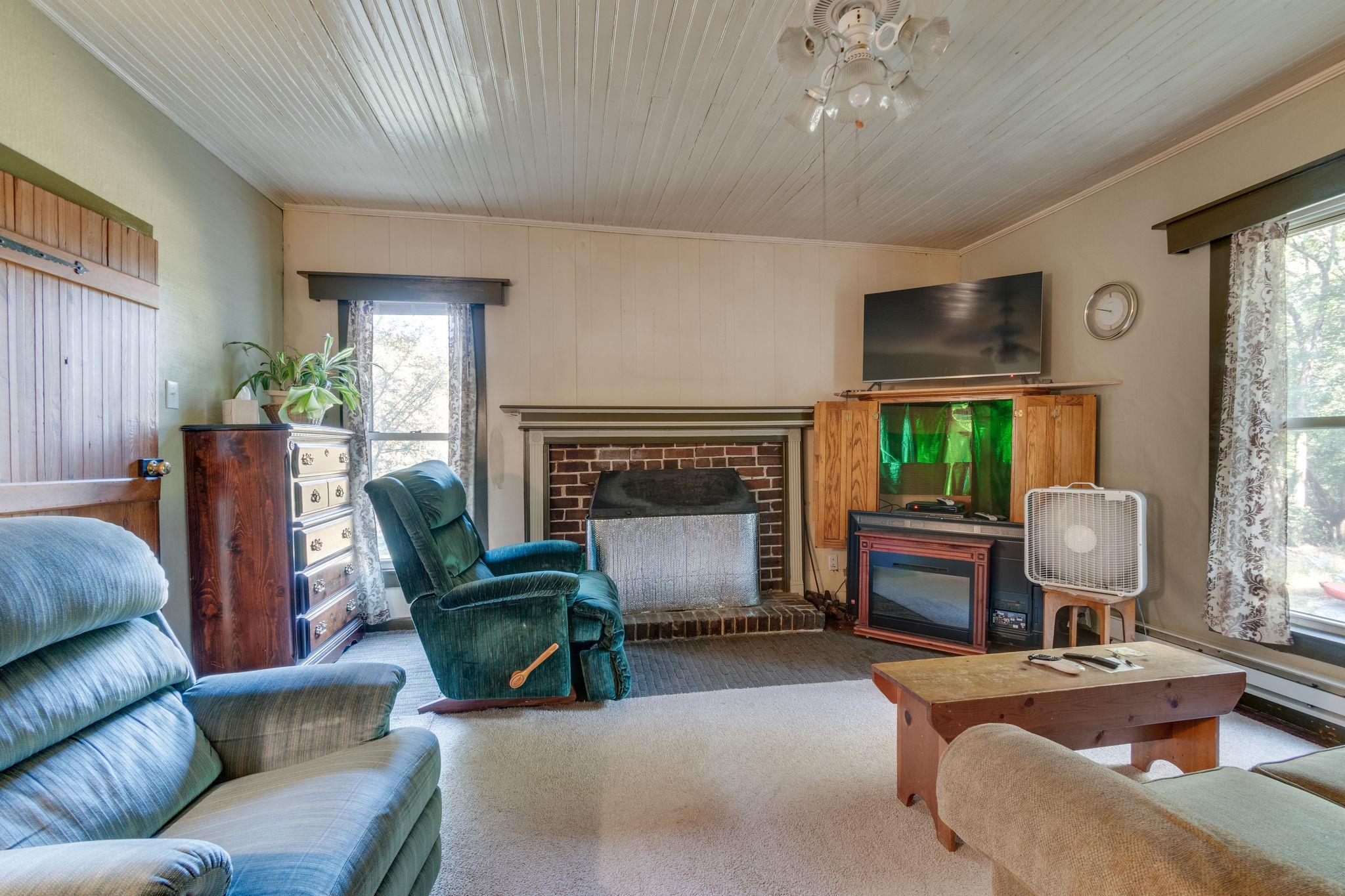 1452 Iron Bridge Road Columbia, TN 38401 - Photo 10 of 19 a living room with furniture a fireplace and a window
