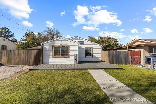 a front view of a house with yard