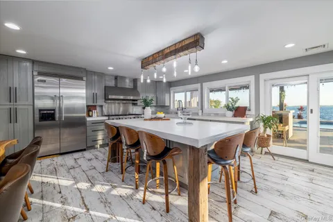 a large kitchen with lots of counter space and a refrigerator